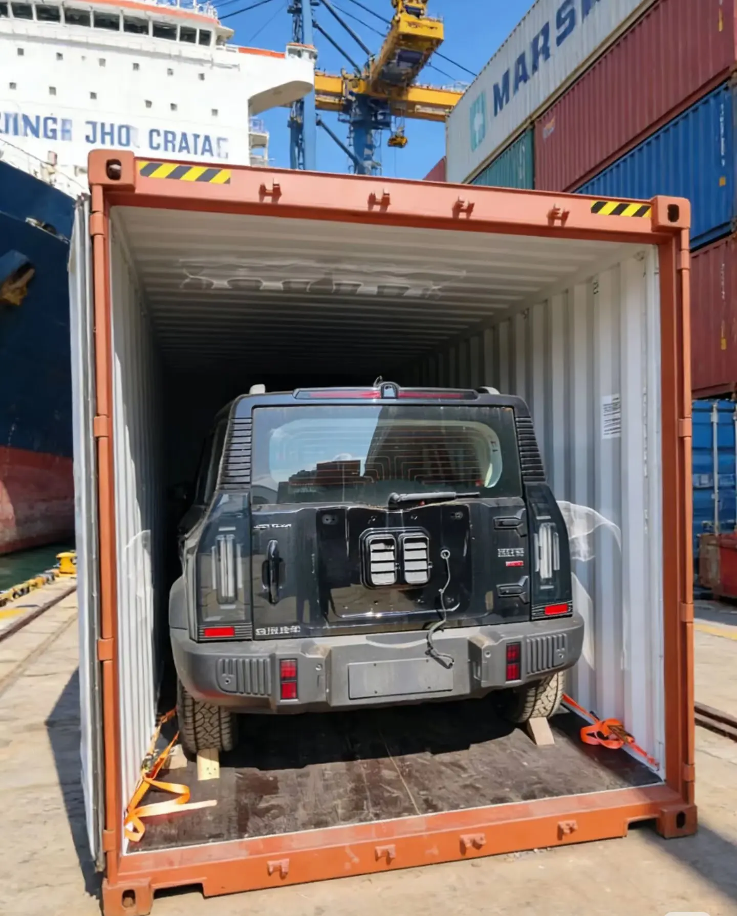 SUV chocked and lashed inside a 40HQ container